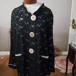 Pretty sequined top, Black and cream colored.  Great with leggings.